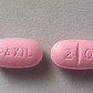 The front and back of two Paxil tablets.