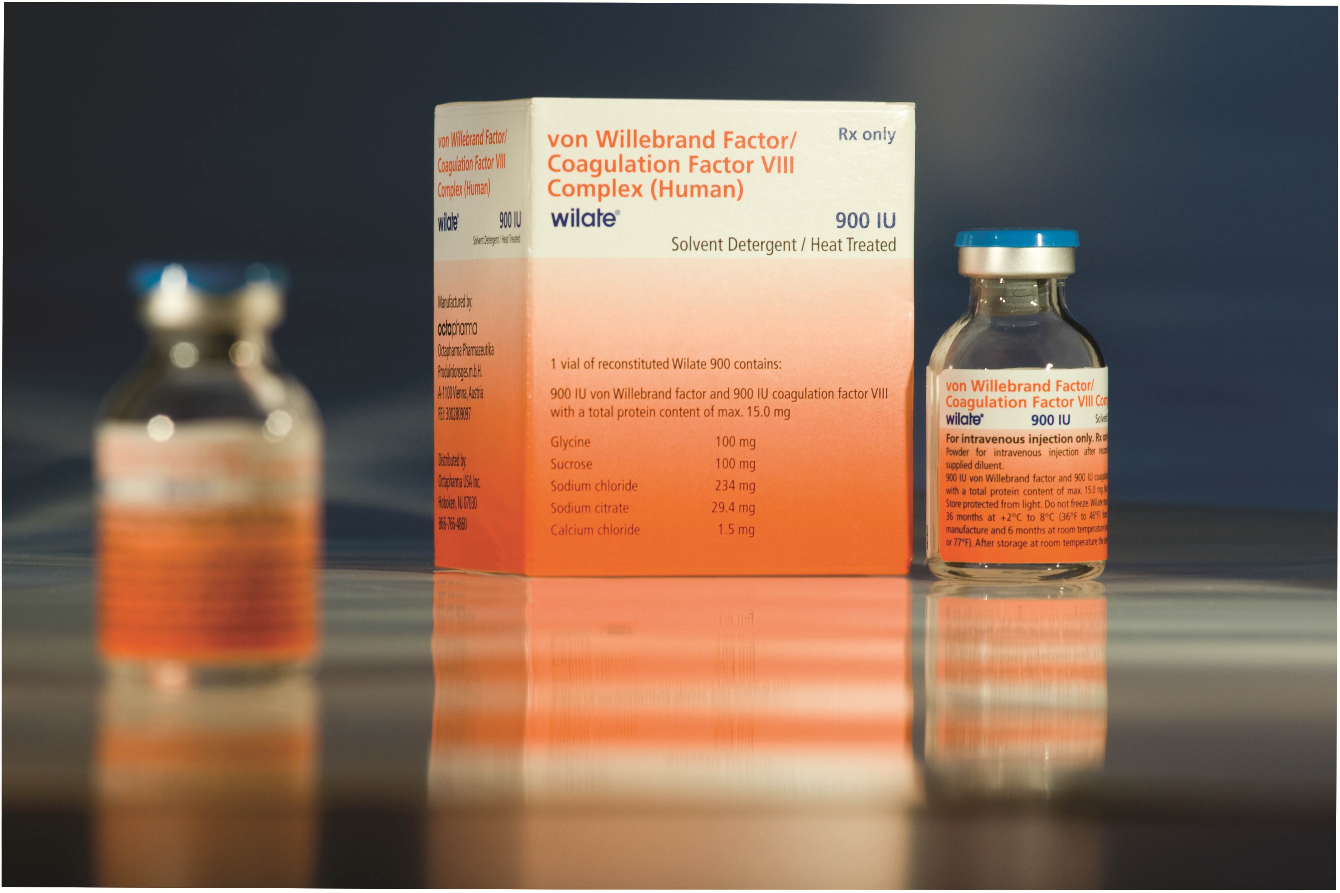 This is an orange colored package of the drug Wilate with a clear vial labeled 900 IU.